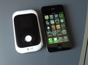 Telstra 4G Hotspot with iPhone 4S for scale